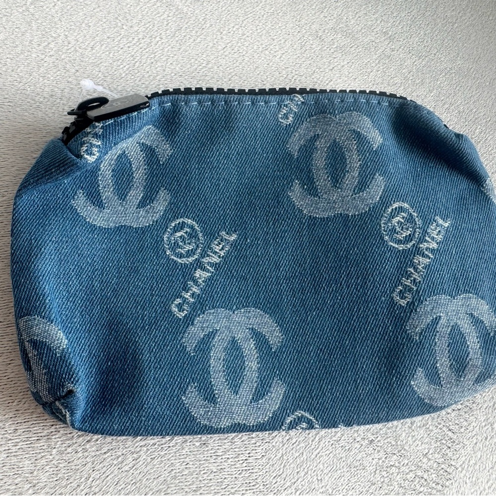 Blue denim logo pouch.